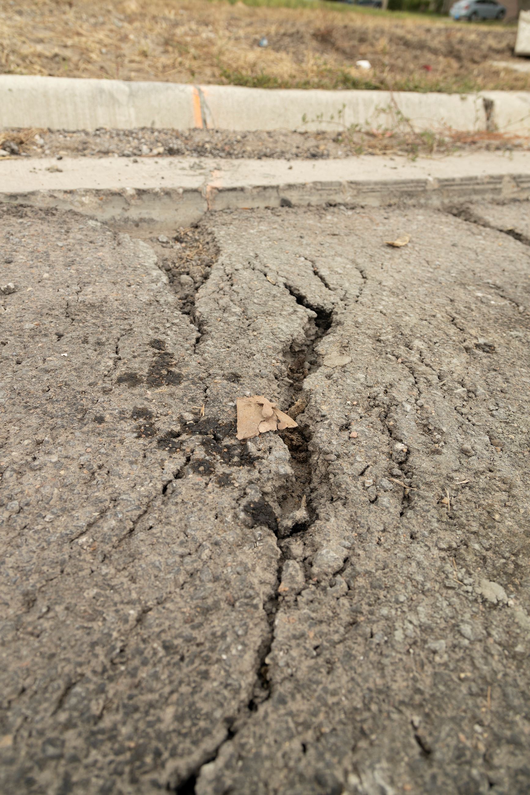 Defects during Woodlawn construction showing large cracks and potholes